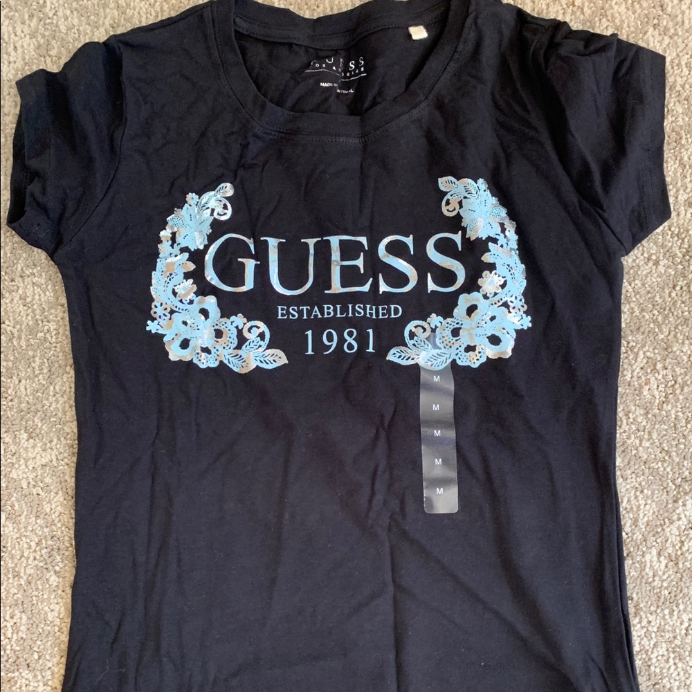 Never worn women’s medium Guess black tee.